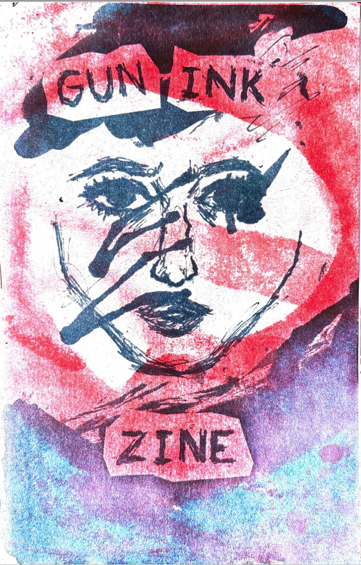 Gun Ink Zine. A face in dark blue-gray ink with a red crossbar across it with swirling blue and purple colors around the crossbar symbol.